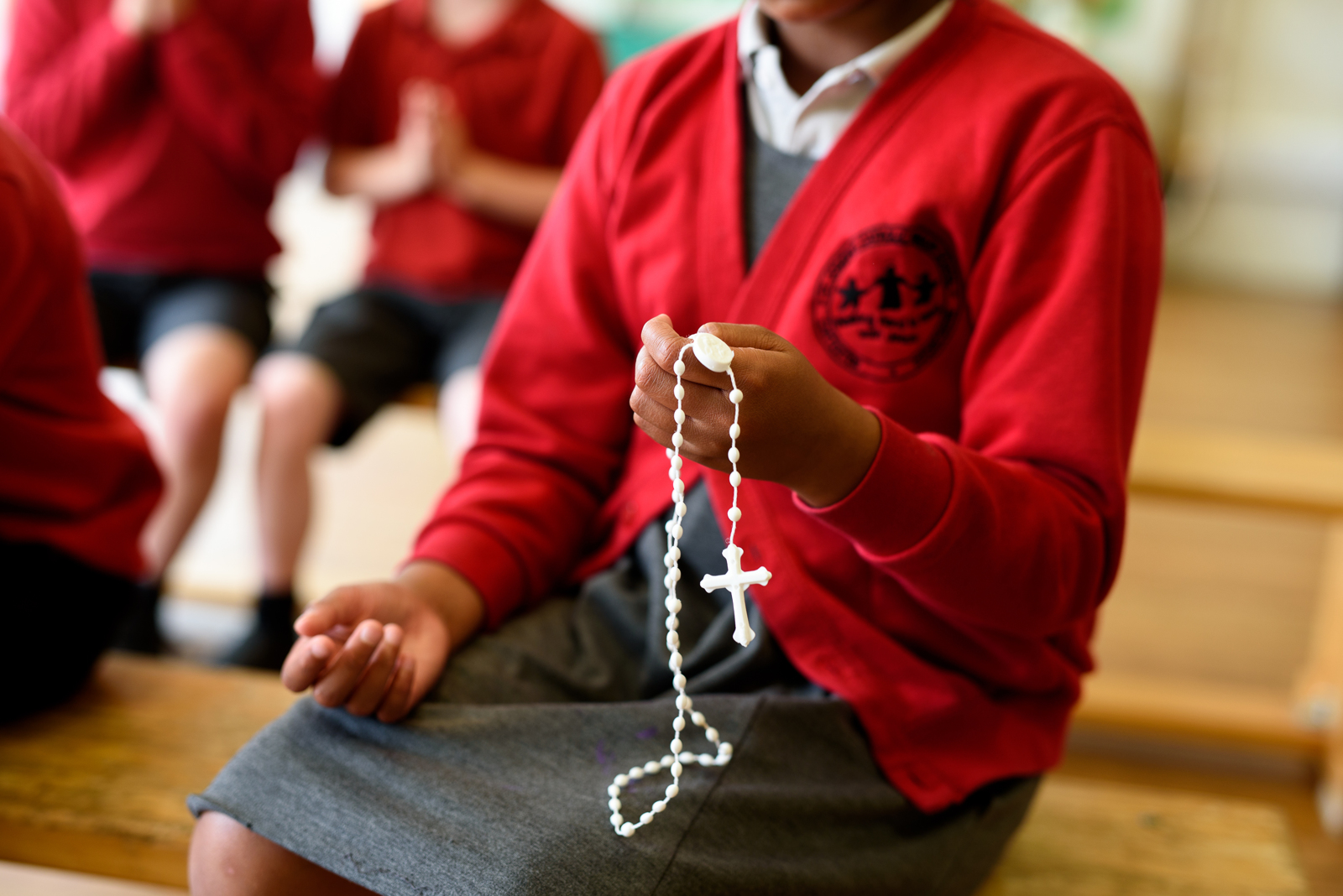 Student holding prayer beads